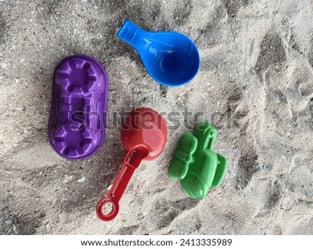 Children's beach toys include sand play equipment.
