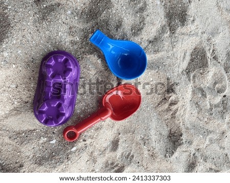 Children's beach toys include sand play equipment.