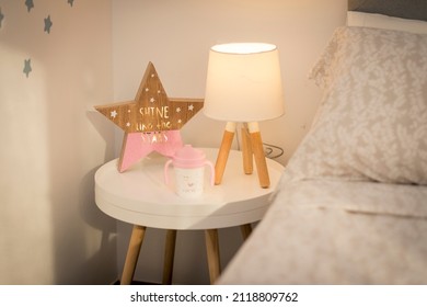 children's bedside table in an environment with illuminated objects - Shutterstock ID 2118809762