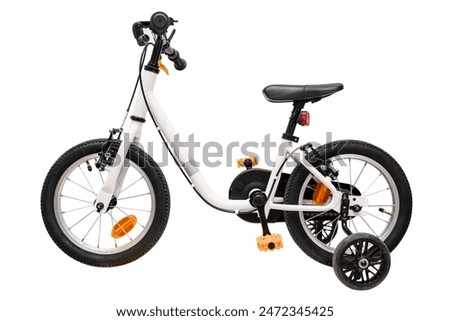 Children's bicycle with supporting side wheels isolated on white background