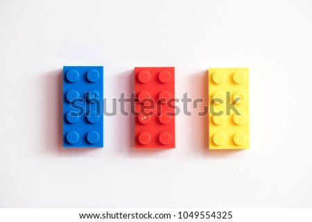 Childrens building blocks similar to legos, yellow red and blue