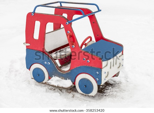 Children\'s car out of\
plywood in the snow