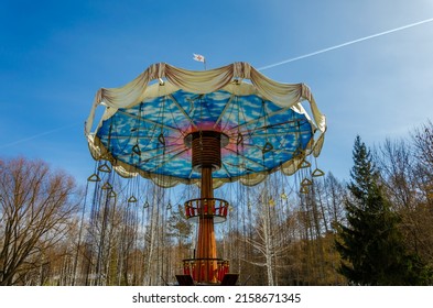 Children's carousel in the park in spring.