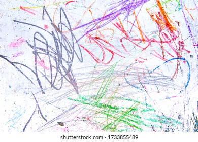 Children`s chaotic drawings in colorful chalk on a white blackboard. Abstract pattern texture background