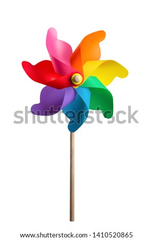 Children`s colorful toy wind turbine isolated on white background