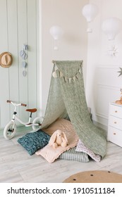Children's corner with toys and a wigwam with pillow