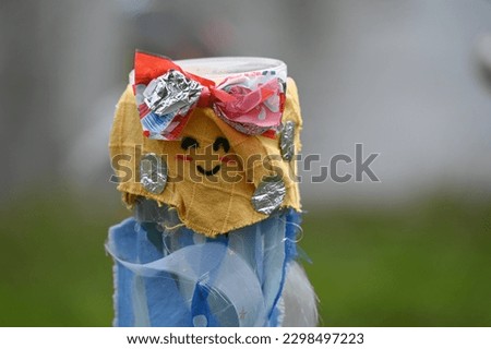 Children's craft: funny face made of packaging material