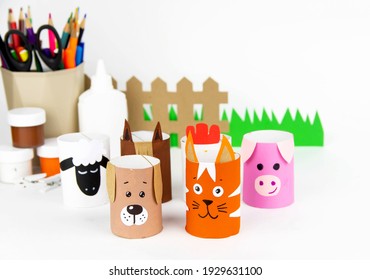 Children's Crafts Farm Pets From Toilet Sleeves. View From Above On Diy Of Farm Animals: Horse, Sheep, Scrolls, Rooster, Dog, Cat. Instruction Step By Step With The Child's Paper.