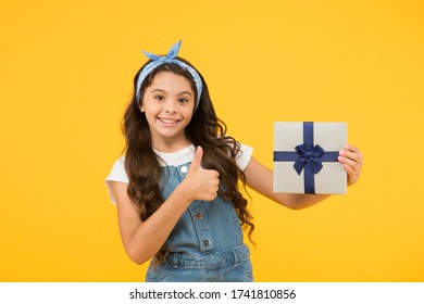 Childrens day. This is for you. Celebrate birthday. Kid birthday gift. Extra bonus. Grateful for good gift. Surprise and present box. Child smiling happy hold gift box. Kid girl delighted gift.