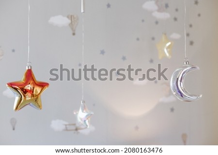 children's decoration in children's close-up. stars and the moon on ropes