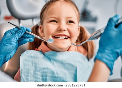 Children's dentistry. Live funny photo of a laughing child at the dentist's appointment. - Powered by Shutterstock