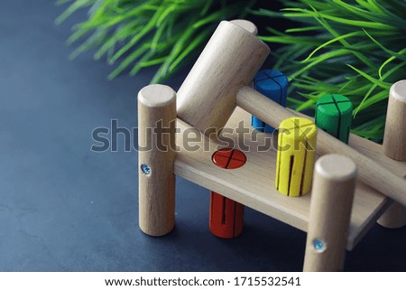 Children's development. Children's wooden toy on table in the play area. Room of children's creativity and self-development. Wooden constructor.
