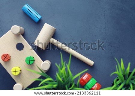Children's development. Children's wooden toy on table in the play area. Room of children's creativity and self-development. Wooden constructor.