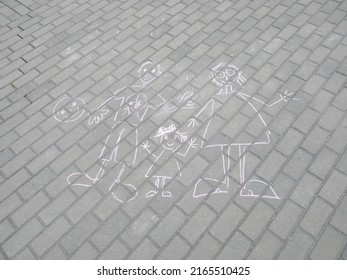 Children's Drawing With Chalk On The Sidewalk - Mom, Dad And Me - A Cheerful Family.