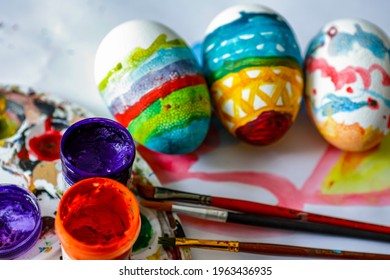  Children's drawing of Easter. Large Easter eggs were painted by small children, brushes and paints. The concept of children's creativity. - Powered by Shutterstock