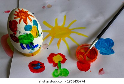  Children's drawing of Easter. Large Easter eggs were painted by small children, brushes and paints. The concept of children's creativity. - Powered by Shutterstock