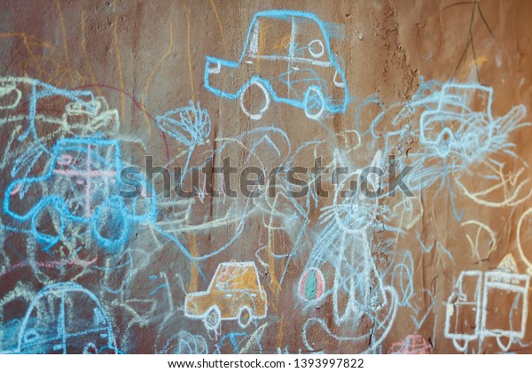 children\'s drawings on the\
wall