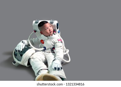 Children's dream job.
Kids Dream Jobs Diversity Occupations.
Little boy in space suit.
Kid in space suit.
Astronaut boy sitting.
