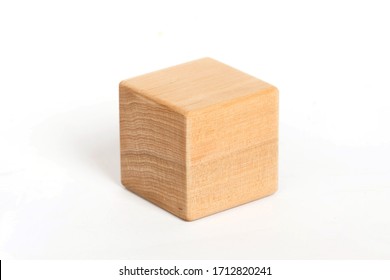 children's eco toys for toddlers, wooden cube isolated on a white background, the development of fine motor skills and thinking in children