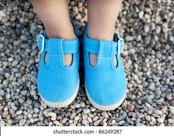 Children's Feet In Blue Shoes