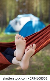 children's feet in a hammock close up