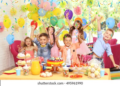Children's funny birthday party in decorated room