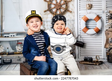 Children's games. Two cute boys play pirates, they have fun and interesting together. - Shutterstock ID 2247787043
