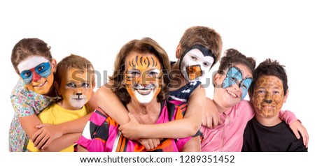 Children's group and grandmother all with animal face-paint isolated in white