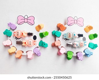 Children's hairpins are pineapple-shaped in various colors and there are also hairpins in the shape of pumpkin dolls. - Powered by Shutterstock