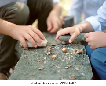 children's hands and nuts