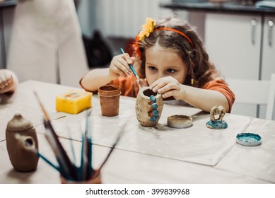 children's hands sculpts clay crafts pottery school - Powered by Shutterstock