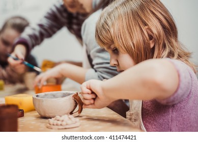 children's hands sculpts clay crafts pottery school - Powered by Shutterstock