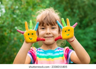 Children's hands with smile paints. Selective focus. People. - Powered by Shutterstock