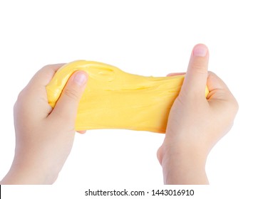 Children's Hands Stretch Homemade Goo And Yellow Slime.