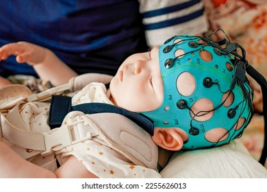 Children's health. Electrical activity of the brain. Diagnosis of diseases and disorders. A sleep child EEG is a recording. Study of a sleeping baby.
