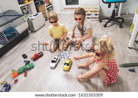 Children's hobbies: Children play at home with radio-controlled models of cars and organized racing competitions.