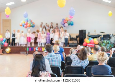 Children's holiday in kindergarten. Children on stage perform in front of parents. image of blur kid 's show on stage at school , for background usage. Blurry - Shutterstock ID 1126031588