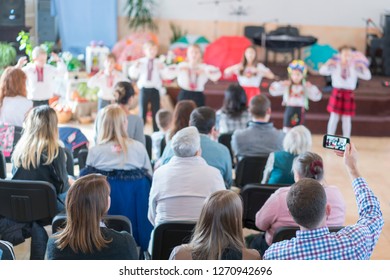 Children's Holiday In Kindergarten. Children On Stage Perform In Front Of Parents. Image Of Blur Kid 's Show On Stage At School , For Background Usage. Blurry.