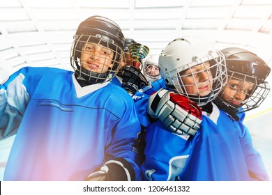 Children's Ice Hockey Team Celebrating Victory