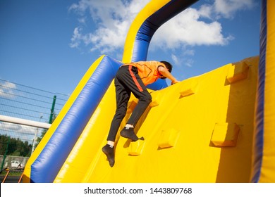 Children's inflatable obstacle course. Entertainment for adults and children. Holidays for the whole family. Inflatable trampolines. - Powered by Shutterstock