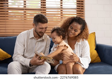 Children's learning, language, and creative skills all benefit from storytelling from parents at an early age. The bonds of affection and warmth within families are strengthened by all of these. - Shutterstock ID 2276769085