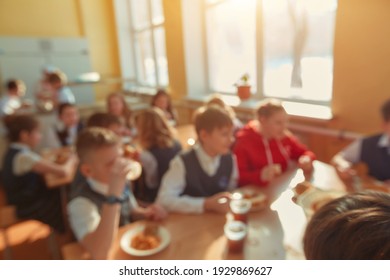 Children's Lunch In The School Cafeteria. Blurring The Cafeteria Background At School. Vintage Style Color Effect