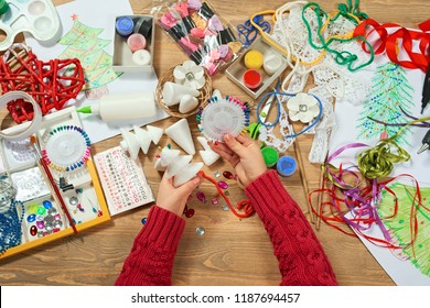 Childrens making decorations for new year holiday. Painting watercolors. Top view. Artwork workplace with creative accessories. - Shutterstock ID 1187694457