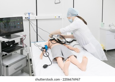 Children's Mannequin For Medical Students. A Nurse Learns To Save A Child In An Emergency. Training In Cardiopulmonary Resuscitation With A Doll.