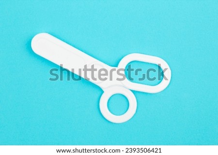 Children's medical instruments. The concept of a pediatrician. Pediatrics. Toy medical devices on a blue background. Choice of profession. Get vaccinated. Scissors
