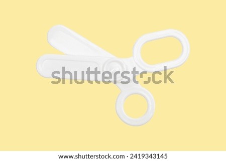 Children's medical instruments. The concept of a pediatrician. Pediatrics. Toy medical devices on a yellow background. Choice of profession. Get vaccinated. Scissors