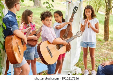 Children's Music Band With Guitars At The Talent Show At The Holiday Camp Or Summer Camp