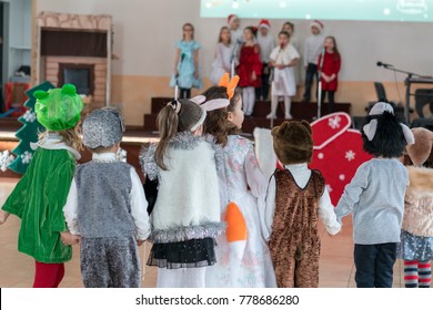 children's music groups sing and dance at the graduation concert. Children in front of their parents show what they have learned. Emotional children's musical shows - Shutterstock ID 778686280