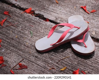 Children's Old Sandals On The Floor