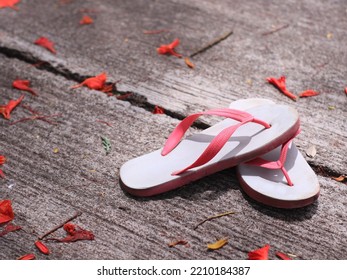 Children's Old Sandals On The Floor